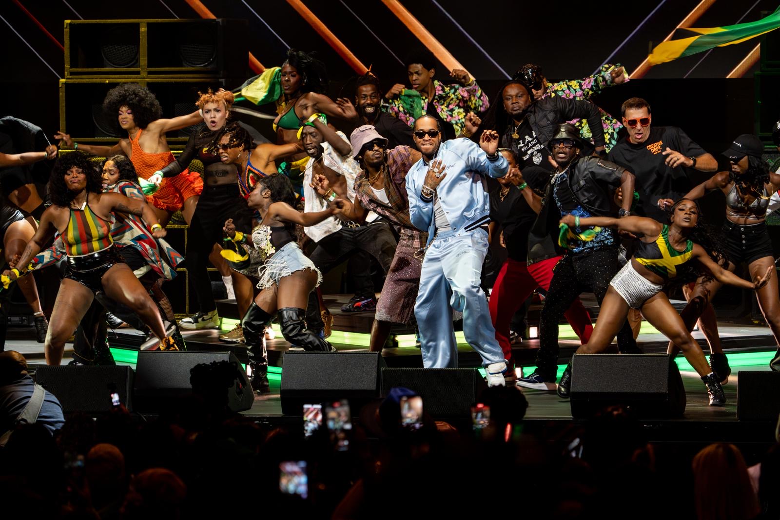 A Caribbean ensemble performs together on the Caribbean Music Awards stage