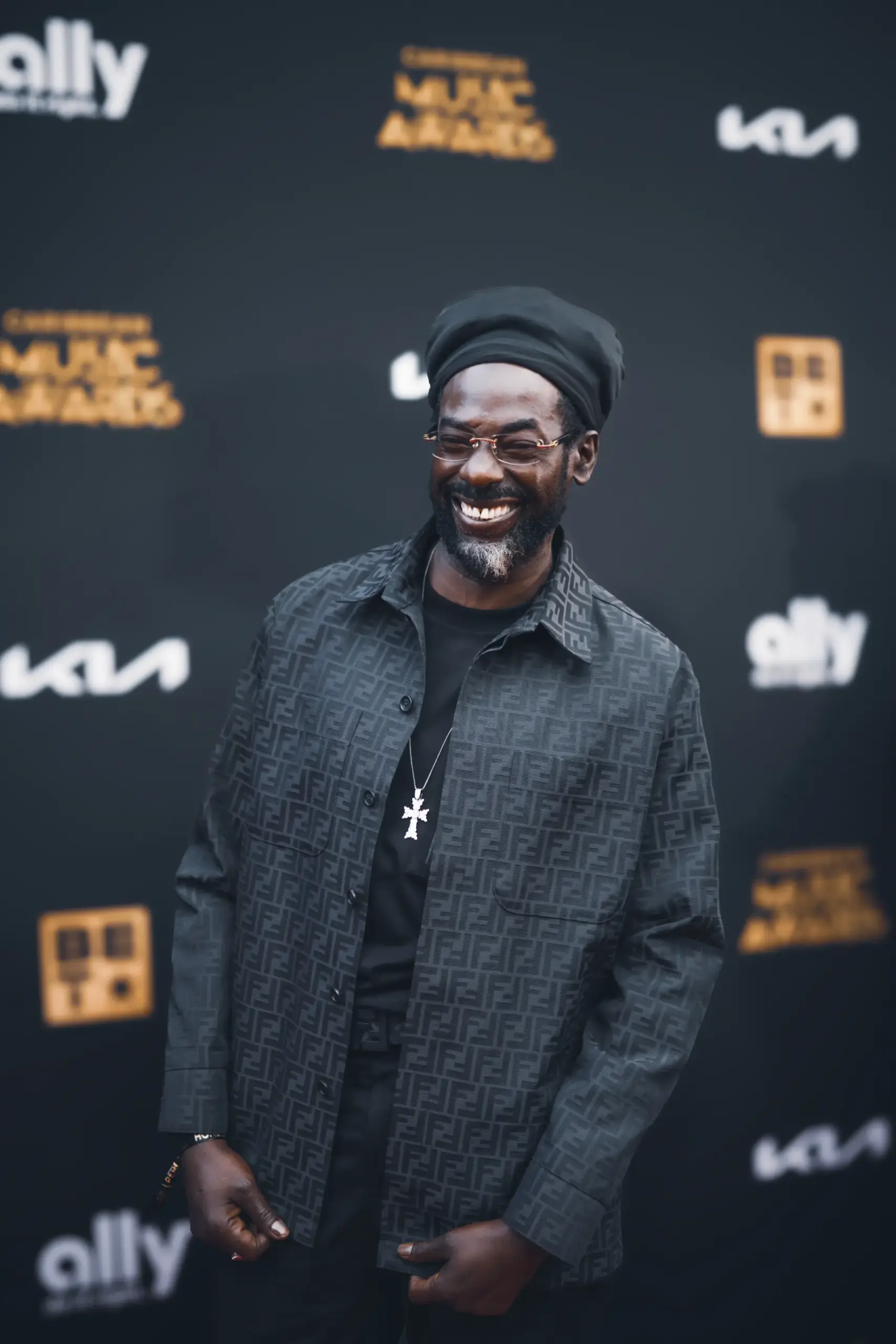 Caribbean Music Awards artist smiling on the 2026 red carpet